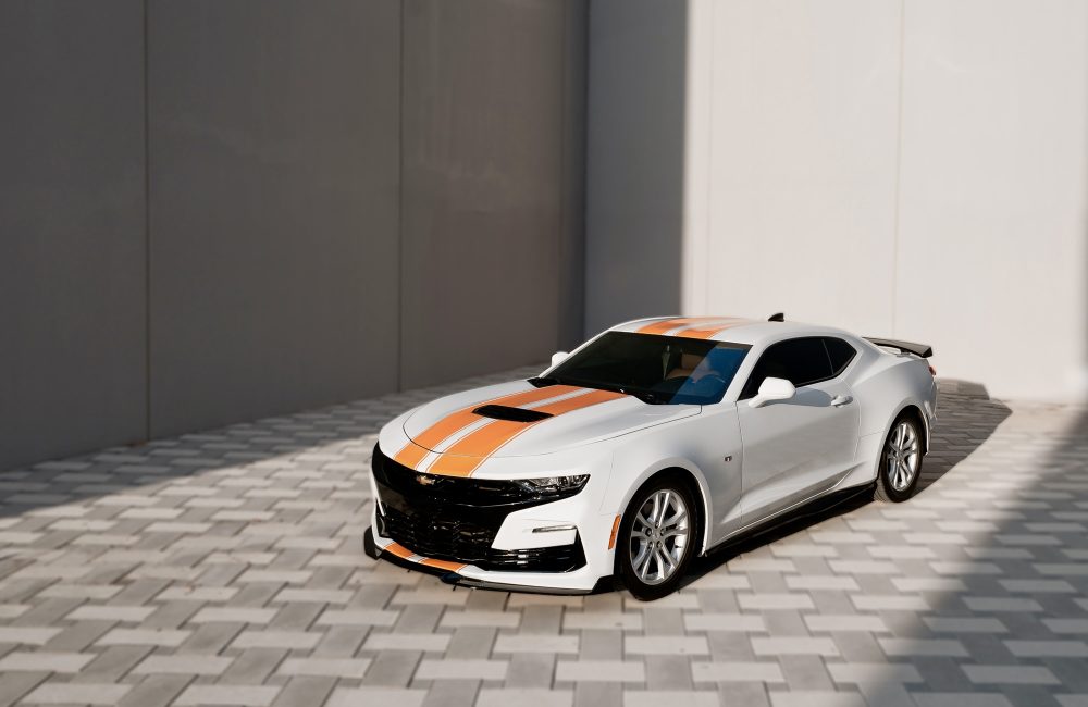 Sleek white Chevrolet Camaro for rent in Dubai offering a bold design powerful performance and modern features for an exhilarating driving experience