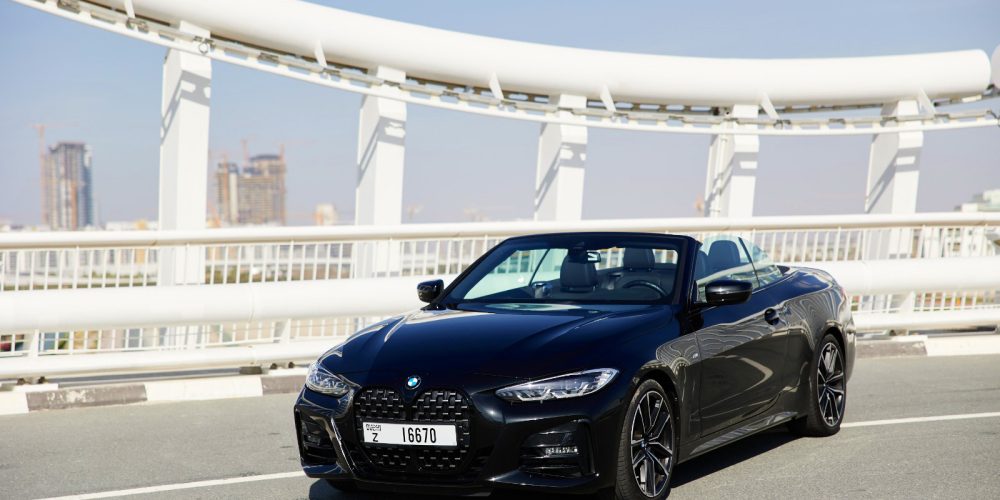 Sophisticated black BMW 430i Cabrio 2023 for rent in Dubai offering luxury and sporty convertible performance