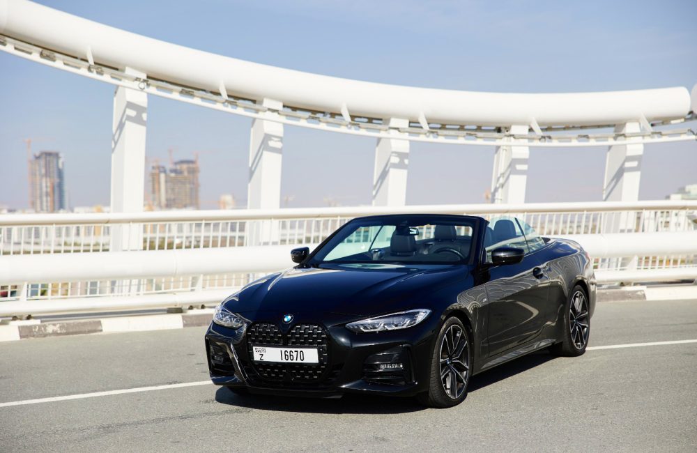 Sophisticated black BMW 430i Cabrio 2023 for rent in Dubai offering luxury and sporty convertible performance