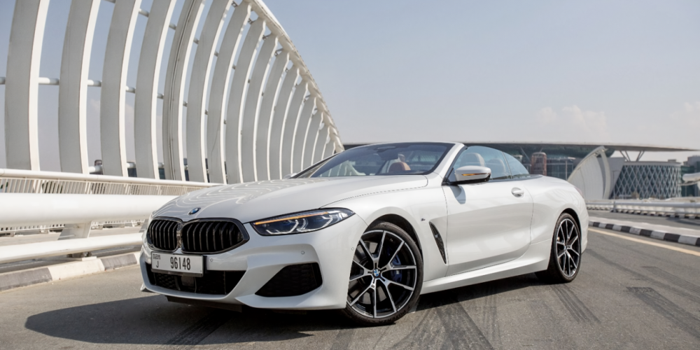 Luxurious white BMW 840i Cabrio 2021 for rent in Dubai offering a premium open-top driving experience with style and performance