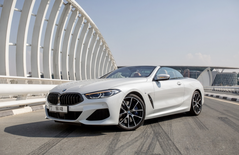 Luxurious white BMW 840i Cabrio 2021 for rent in Dubai offering a premium open-top driving experience with style and performance