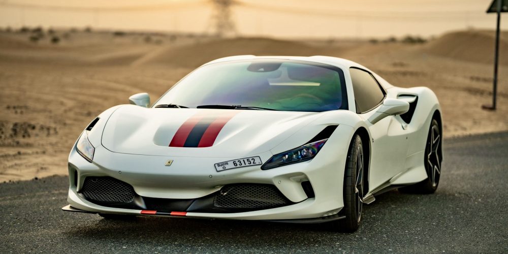 Elegant white Ferrari F8 Tributo Spider for rent in Dubai offering a luxurious open-top driving experience with high-performance engineering sleek design and advanced technology