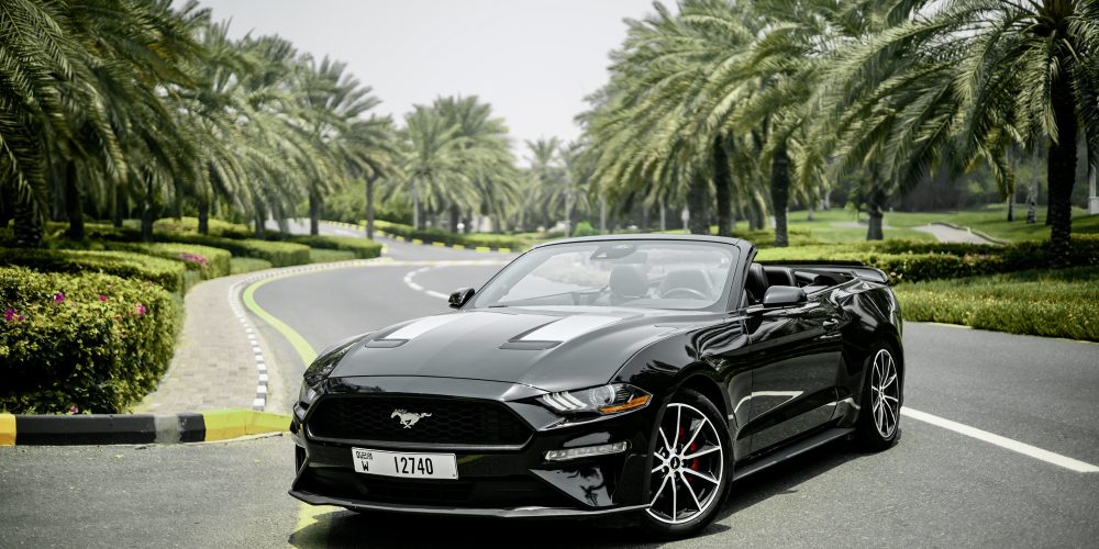 Sleek black Ford Mustang for rent in Dubai offering powerful performance modern features and an iconic design for an exhilarating driving experience