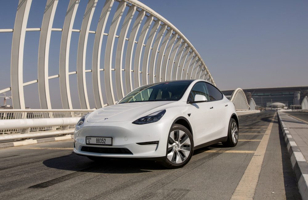 Sleek white Tesla Model Y Long Range 2022 for rent in Dubai offering advanced electric performance modern design and premium comfort