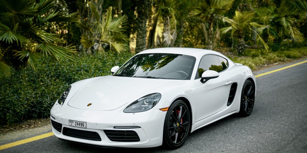 Elegant white Porsche Cayman S for rent in Dubai offering a perfect blend of sporty performance sleek design and advanced technology for an exhilarating driving experience