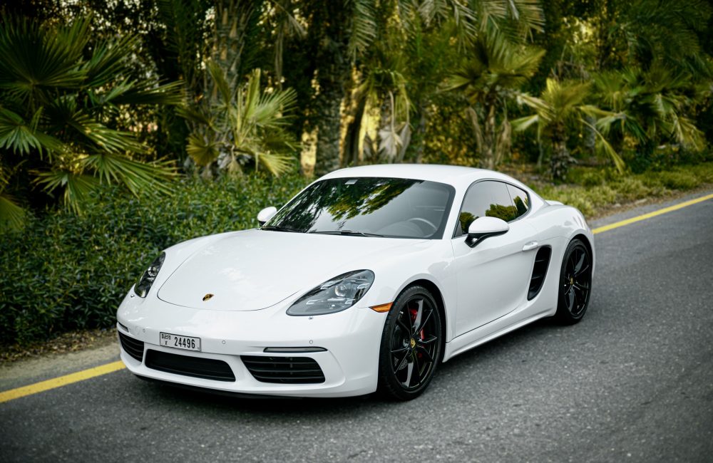 Elegant white Porsche Cayman S for rent in Dubai offering a perfect blend of sporty performance sleek design and advanced technology for an exhilarating driving experience