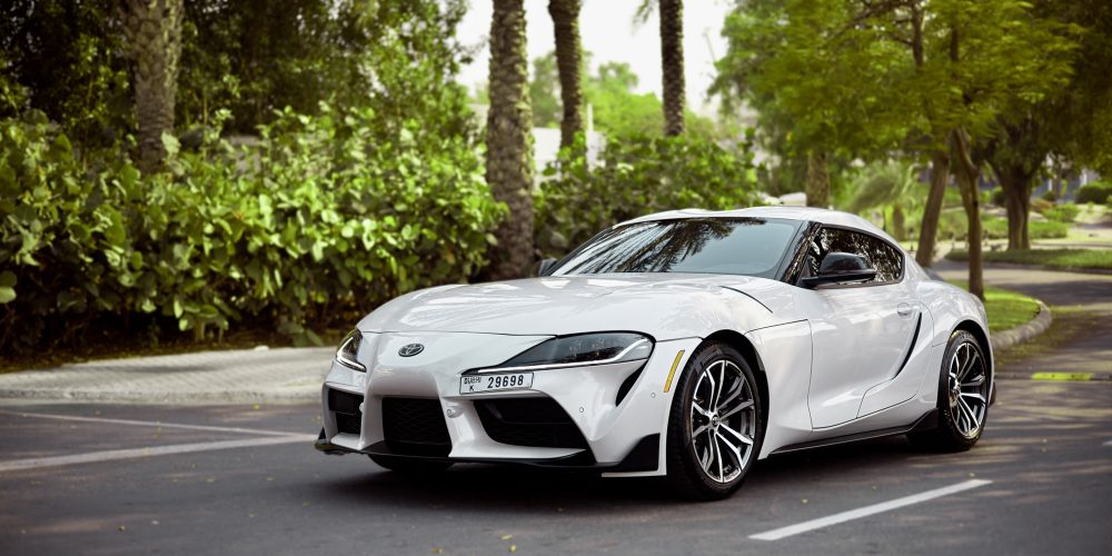 Sporty white Toyota Supra for rent in Dubai offering high-performance engineering sleek design and advanced technology for an exhilarating driving experience