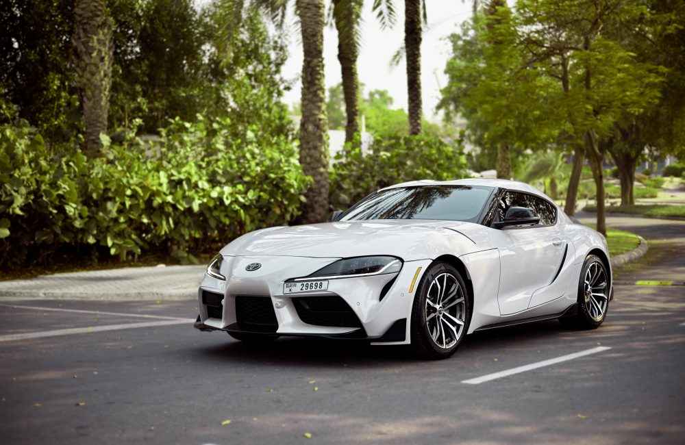 Sporty white Toyota Supra for rent in Dubai offering high-performance engineering sleek design and advanced technology for an exhilarating driving experience